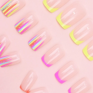 Detailed view of neon French tip press-on nails with colorful line art and gold foil accents