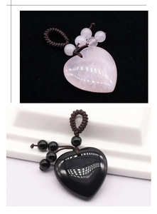 Detail of hand-woven heart pendants in pink crystal and black obsidian with beaded cords