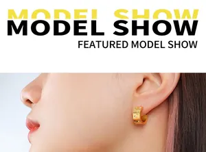 Close-up of 18k gold plated C-shaped earrings with micro-set cubic zirconia on model
