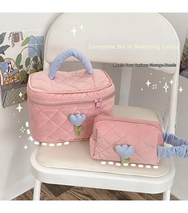 Pink quilted corduroy cosmetic bag set with cute tulip floral detail and soft handle