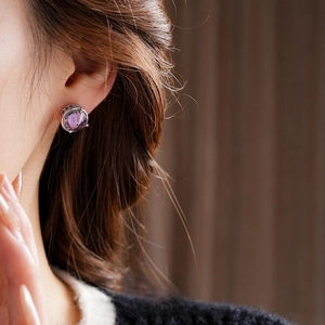 18k gold plated vintage silver needle earrings with purple zircon crystals on model