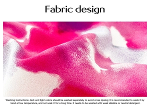 Detail of abstract pink and purple print fabric with washing care instructions for dress