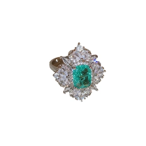 Elegant silver open ring with rectangular green emerald stone and zircon pavé setting