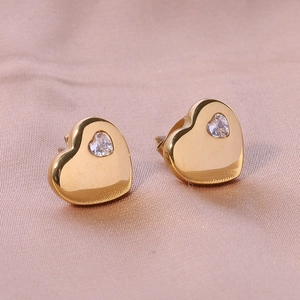 Detailed view of 18K gold-plated heart earrings with heart-cut cubic zirconia inlays