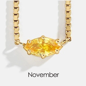 Detail of 18K gold-plated box chain necklace with November marquise yellow birthstone