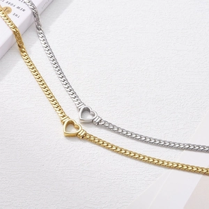 Minimalist gold and silver heart snake chain necklaces in a modern polished finish