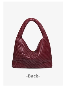 Back view of a luxury burgundy hand-woven leather hobo bag with intricate cross-weave detail