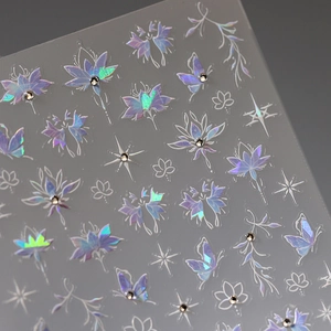Holographic flower and butterfly nail art stickers with small rhinestones on backing