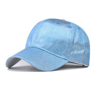 Detailed view of the bright blue sequined baseball cap with shimmering metallic texture
