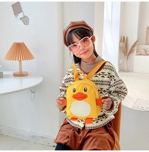 Cute yellow cartoon duck toddler backpack worn by a child with adjustable straps