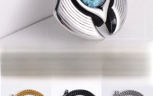 Macro detail of silver evil eye pendant with blue crystal and three chain color options