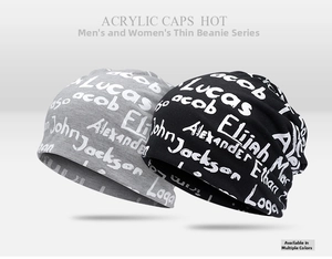 Close-up of thin breathable acrylic beanies with white graffiti style letter prints