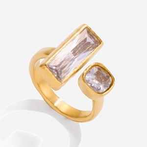 Macro detail of 18K gold stainless steel open ring with square and rectangle zircons