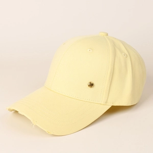 Detail of light yellow cotton baseball cap with distressed brim and gold H metal buckle