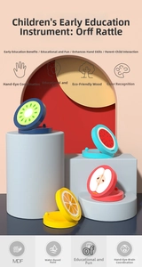 Detail of wooden fruit castanets showing kiwi, watermelon, apple and orange designs