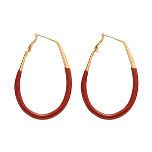 Retro oversized gold-toned oval hoop earrings with red enamel drop-shaped design
