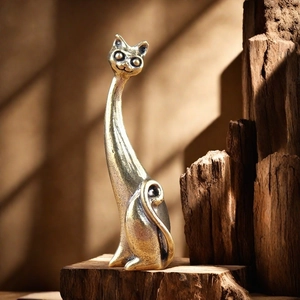 Artistic brass long-neck cat ring holder sculpture on a rustic wood base for home decor