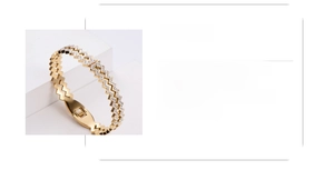 Detail of gold-plated stainless steel bracelet featuring zigzag pavé crystals with size specs