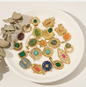 Macro shot of 18k gold plated stainless steel pendants with various natural stones