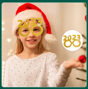 Golden glitter 2023 number glasses frame for Christmas party shown on a model