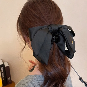 Elegant large black satin bow hair claw clip for women back view hairstyle