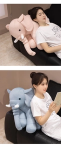 Soft elephant plush pillow in pink and blue waffle knit fabric used for back support
