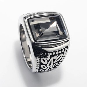 Detailed close-up of retro silver stainless steel ring with rectangle dark gemstone