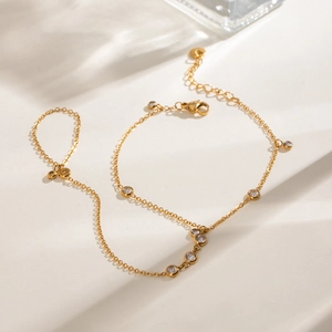 Luxurious gold stainless steel hand chain bracelet with sparkling zircon stones