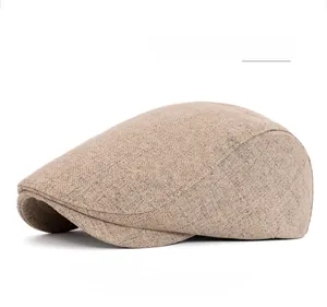 Detailed close-up of khaki newsboy cap showing cotton canvas texture and adjustable buckle