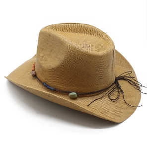 Close-up of woven straw Panama hat with rustic colorful stone beads and cord trim