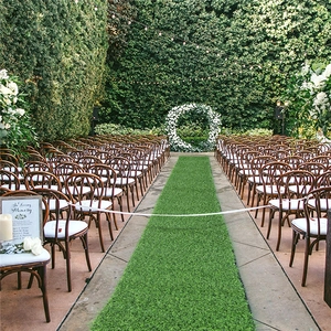 Close-up of high-density artificial grass table runner for outdoor wedding decoration