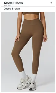 Detail showing high-waisted seamless yoga pants in cocoa brown on a model posing