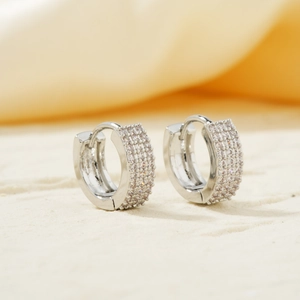Elegant silver huggie earrings with three rows of micro-paved sparkling cubic zirconia