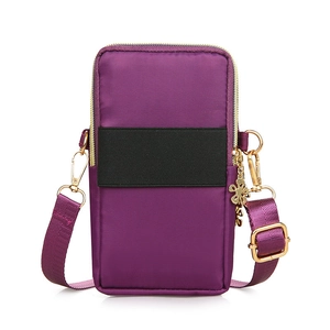 Vertical purple nylon mini crossbody phone bag for women with floral charm and gold zippers