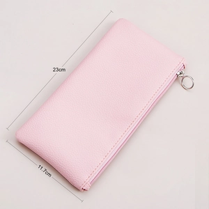 Pink pebbled leather makeup brush bag with silver ring zipper measuring 23cm by 11.7cm