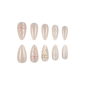 Cat eye almond press-on nails with 3D bows and quilted patterns in champagne nude finish