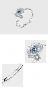 Macro detail of S925 sterling silver stamp and pave setting blue zircon evil eye ring