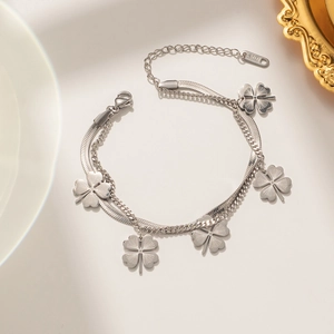 Double-layered stainless steel bracelet with clover pendants and silver snake chain