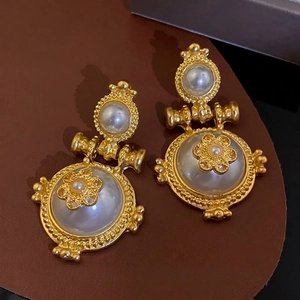Vintage baroque pearl earrings with golden flower design and silver pins for women