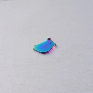 Close-up of rainbow stainless steel mother and child bird pendant DIY jewelry accessory