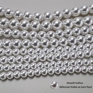 Polished white glass pearls in multiple sizes with high luster and mirror reflection