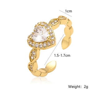 Close-up of heart-shaped zircon ring with gold-plated wavy leaf band and dimension details