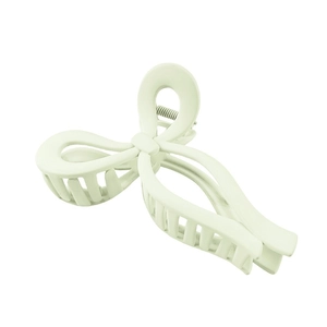 Matte mint green bow-shaped hair claw clip with multi-tooth design for styling