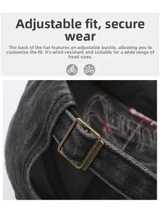 Close-up of adjustable bronze metal buckle and twill cotton fabric on baseball cap