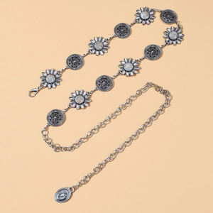 Detail of vintage silver sunflower metal waist chain with embossed circular pendants
