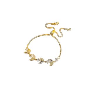 Adjustable gold plated leaf bracelet with sparkling cubic zirconia on white background