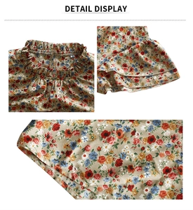 Detail view of floral blouse collar with ruffled edges and size S label detail