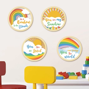 Set of 4 circular wooden rainbow cloud wall plaques with inspirational quotes for kids