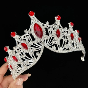 Silver Baroque bridal crown with red rhinestones and crystals on a black background