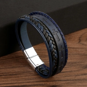 Detail of multi-layer woven leather bracelet with magnetic metal clasp and cross pattern
